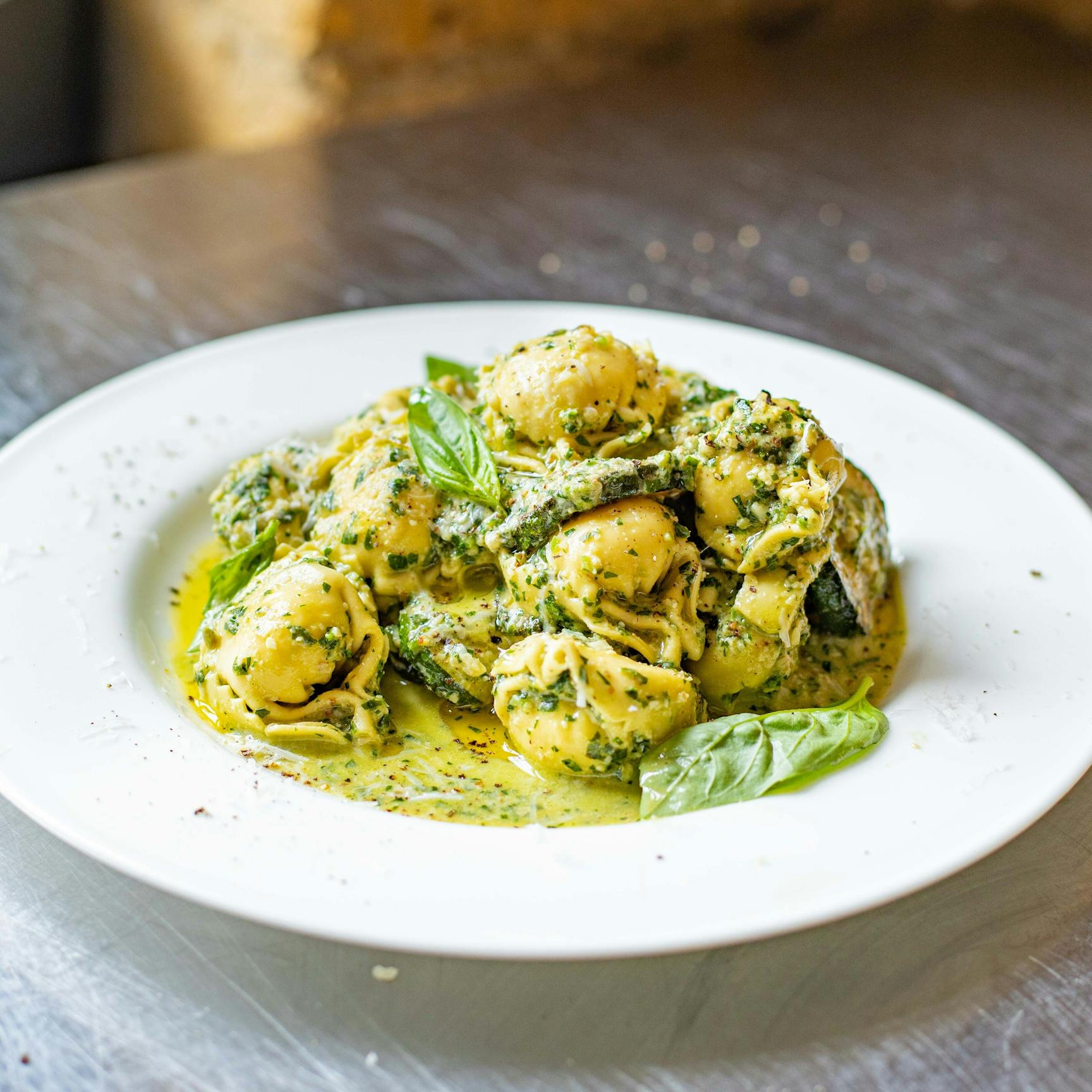 Spinach Tortelloni With Golden Courgettes Spicy Walnut Pesto