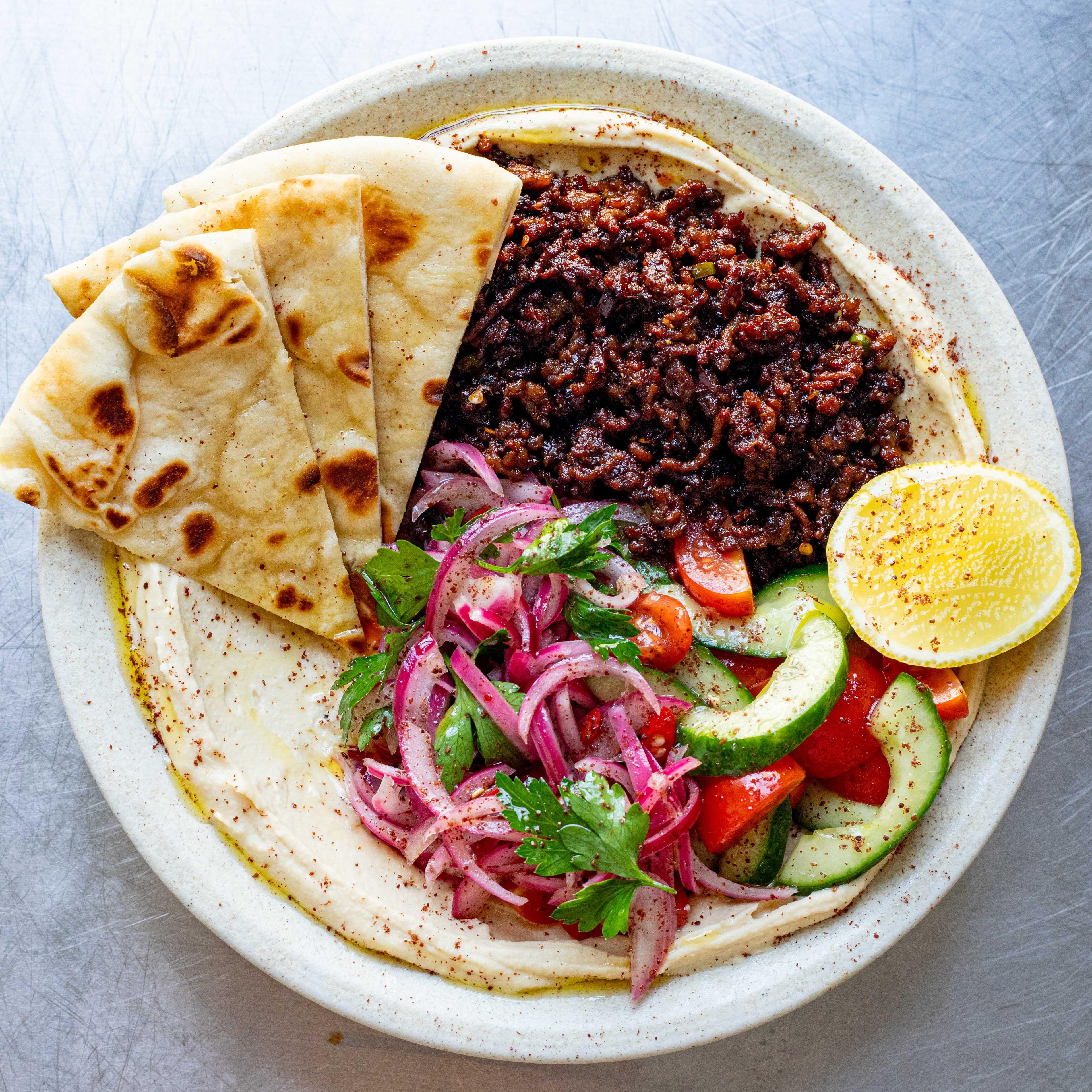 Crispy Harissa Lamb Hummus Bowl