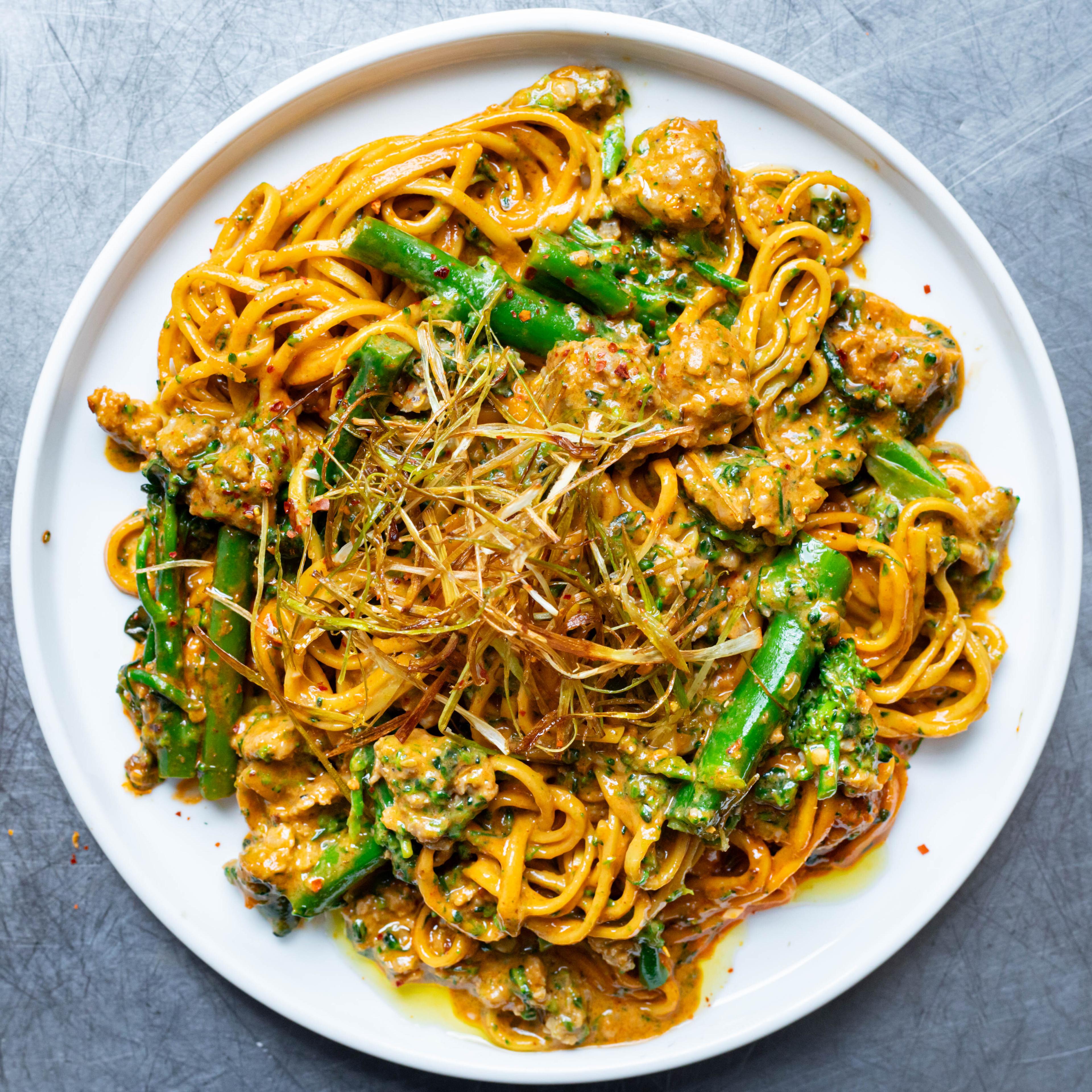 Spicy Sausage Gochujang Noodles with Crispy Spring Onions